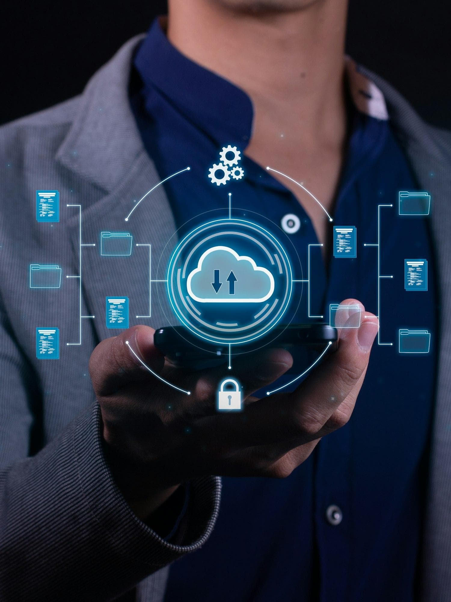 A person holding a phone with a connected cloud data network overlay